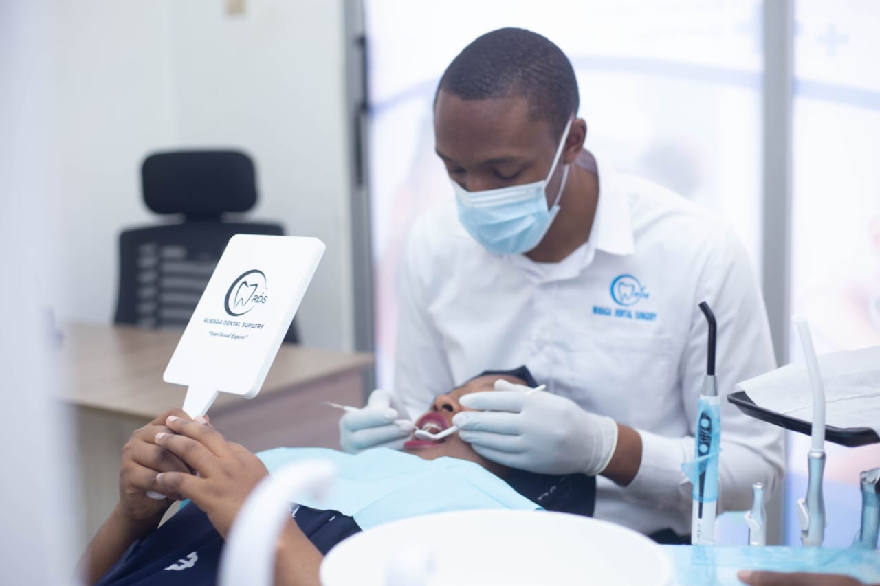 Chairside dental treatment in progress at Rubaga Dental Surgery